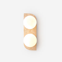 Varro Travertine Wall Lamp - two frosted glass globes in travertine surround, plain background