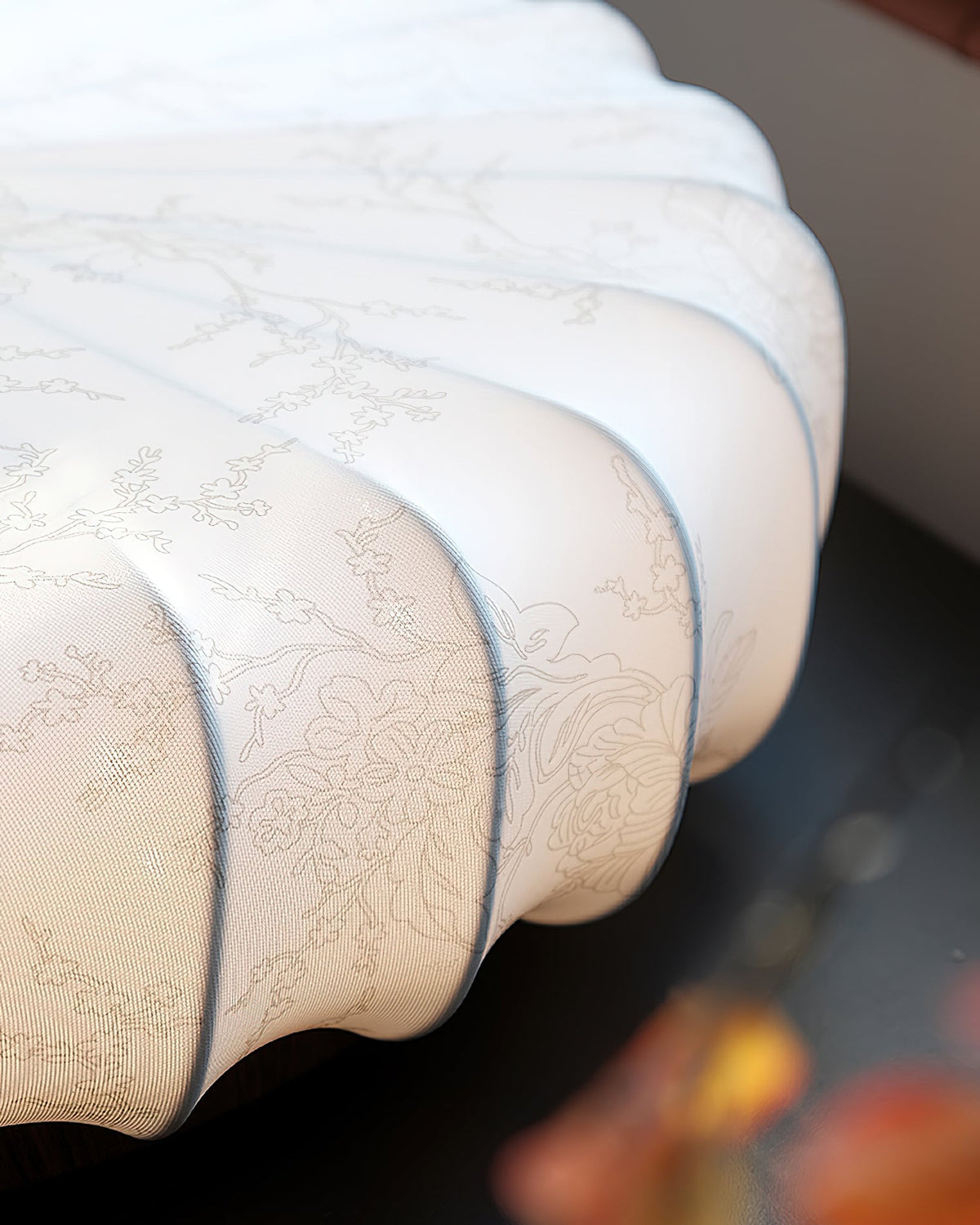 Close-up of the pleated woven fabric on the Larso ceiling light shade