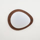 Quisto Pebble Walnut Ceiling Light on a plain background showing the pebble outline and walnut wood grain rim
