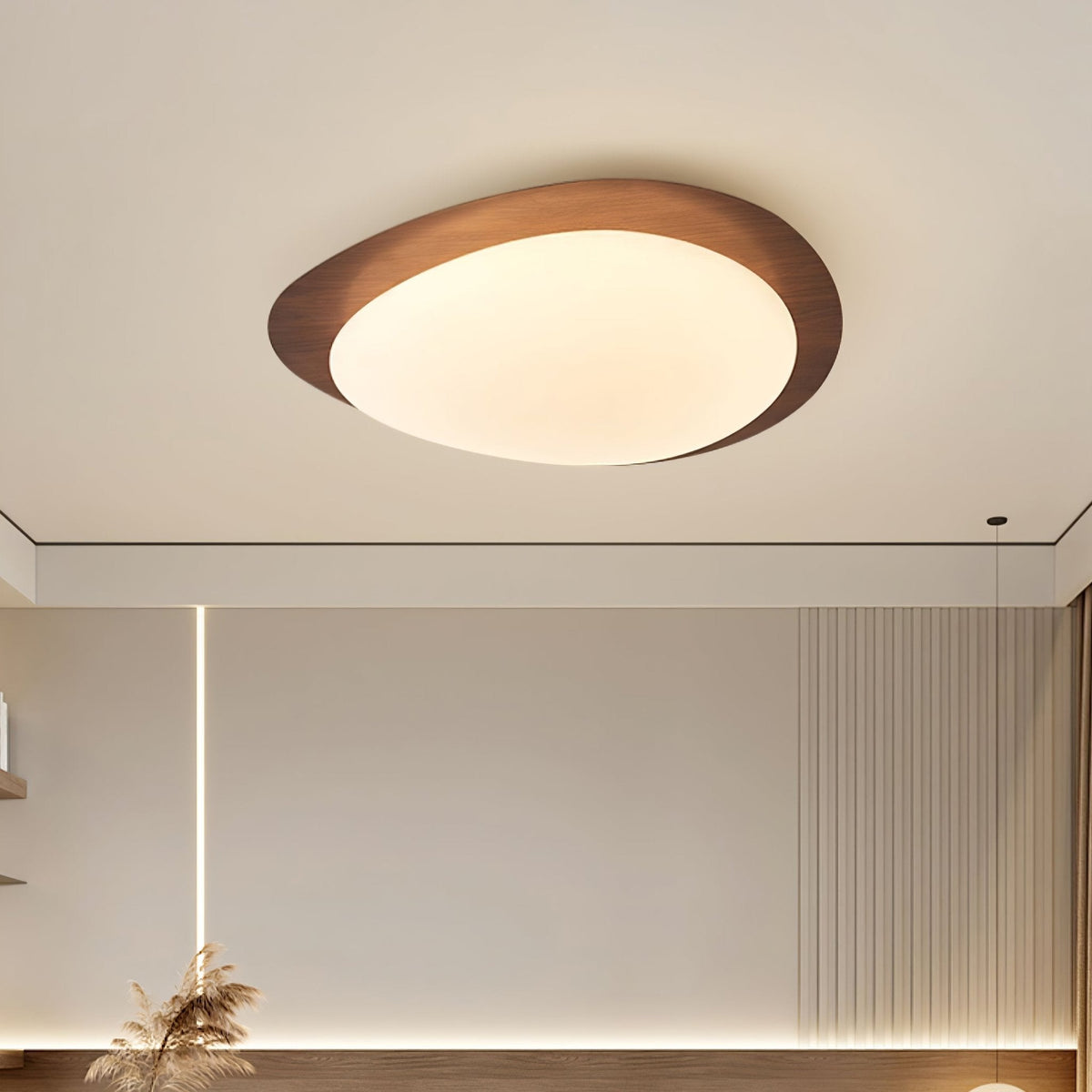 Quisto Pebble Walnut Ceiling Light on a pale ceiling above a neutral interior