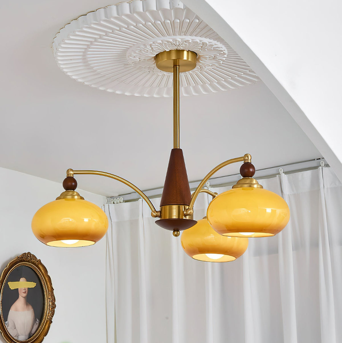 Remi 3-arm chandelier in room lifestyle caramel glass