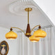 Remi 3-arm chandelier in room lifestyle caramel glass