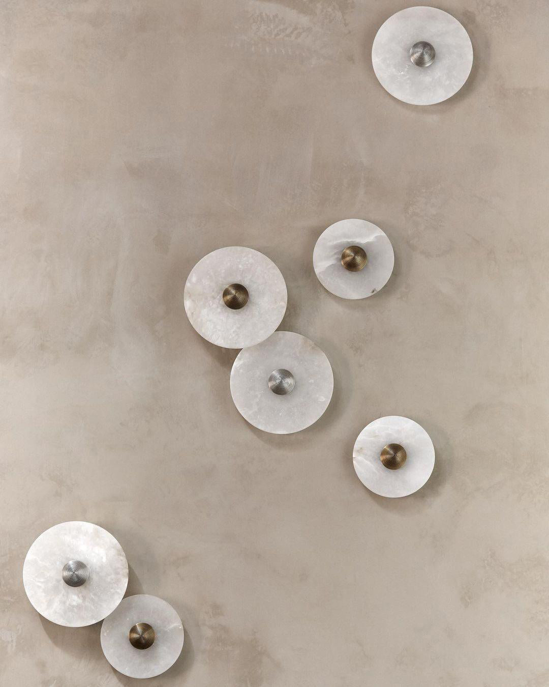 Corven alabaster disc sconces gallery wall – multiple diameters displayed