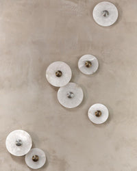 Corven alabaster disc sconces gallery wall – multiple diameters displayed