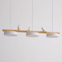 Side view of the Clifo pendant light showing the ceramic birds perched along the natural wood bar