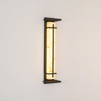 Rayo alabaster wall light shown lit at an angle against a plain wall