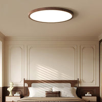 Ivero Ultra-Slim Ceiling Light fitted in a panelled bedroom with a rattan headboard