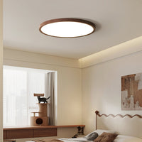 Ivero Ultra-Slim Ceiling Light in a bedroom with a window and low timber sideboard