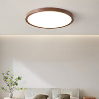 Ivero Ultra-Slim Ceiling Light lit above a bed in a bright neutral bedroom