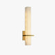 Ritto Alabaster Column Wall Light on a plain white background showing the alabaster block and brass bracket