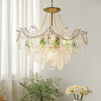 Delvi pearl glass chandelier hanging beside a bright window with sheer curtains