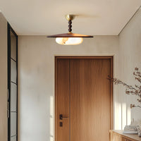 Walo Walnut Alabaster Effect Ceiling Light in a hallway above a timber door