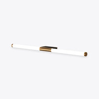 Morva linear wall light, a slim white acrylic tube with a gold centre bracket and end caps, on a plain white background