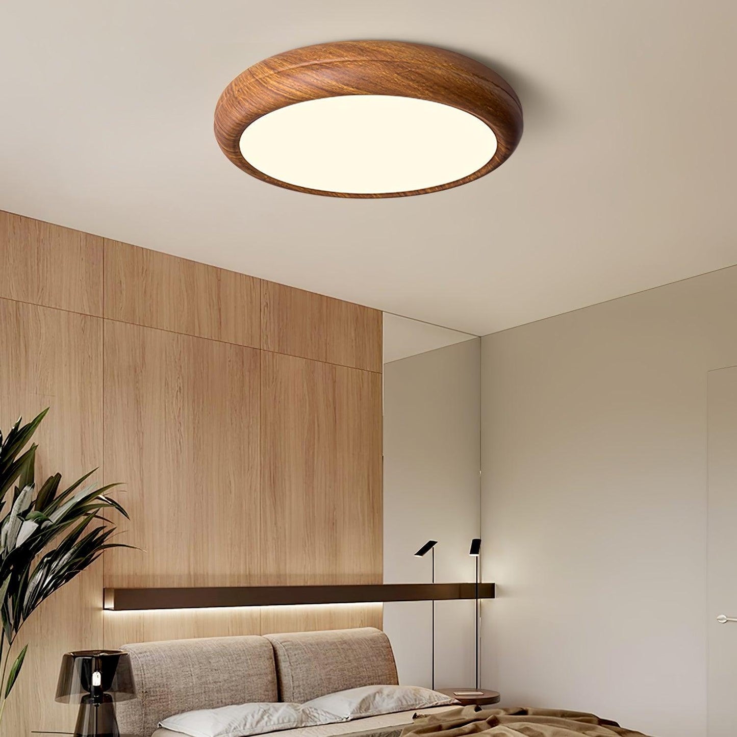 Greno round flush mount ceiling light glowing warm white in a bedroom with oak wall panelling