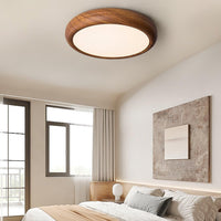 Greno walnut ceiling light casting even light across a bright bedroom ceiling