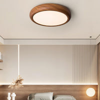 Greno wood grain ceiling light mounted close to the ceiling in a minimal bedroom