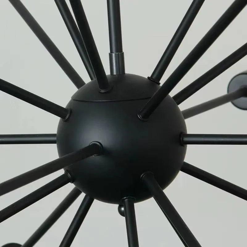 Close up of the matt black centre sphere and arm joints of the Kytto sputnik chandelier