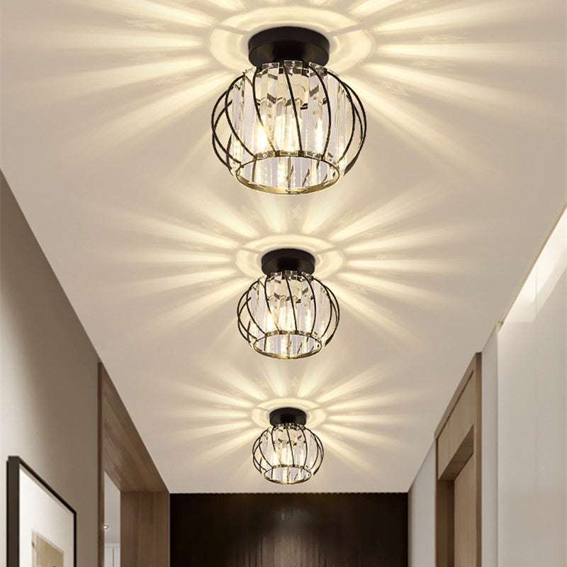 Row of three Relia black ceiling lights casting starburst patterns down a hallway