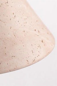 Close view of the open pores and banding in the travertine cone of the Marlo wall light