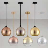 Perforated glass pendant light