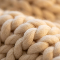 Chunky knit throw loop and yarn texture detail