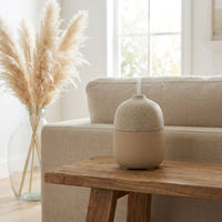 Aura ceramic stone diffuser on a living room console table
