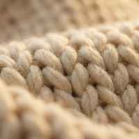 Chunky knit throw loop and yarn texture detail