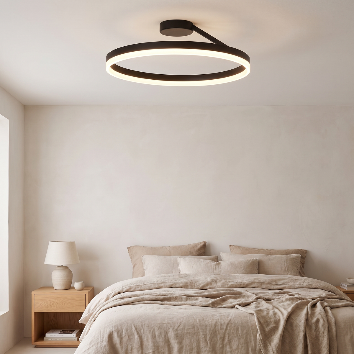 Soleno Circle Ceiling Light fitted to the ceiling of a calm bedroom with linen bedding and plaster walls