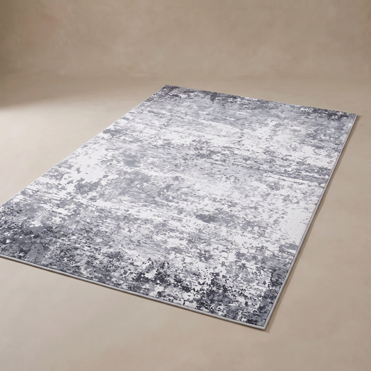 Marlo Abstract Pearl Velvet Rug in grey, full 160 x 230 cm rug shown flat on a warm-neutral plaster backdrop