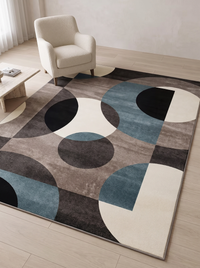 Lindo rug shown beside a boucle armchair and low coffee table, giving a sense of its 120 x 160 cm scale