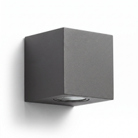 Dovra square wall light on a plain white background showing the cube form and downward glass lens
