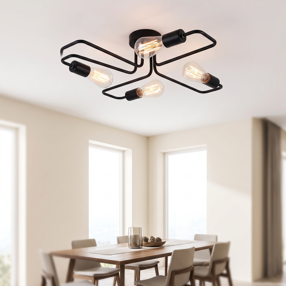 Indro black four-arm flush ceiling light above a dining table in a bright room