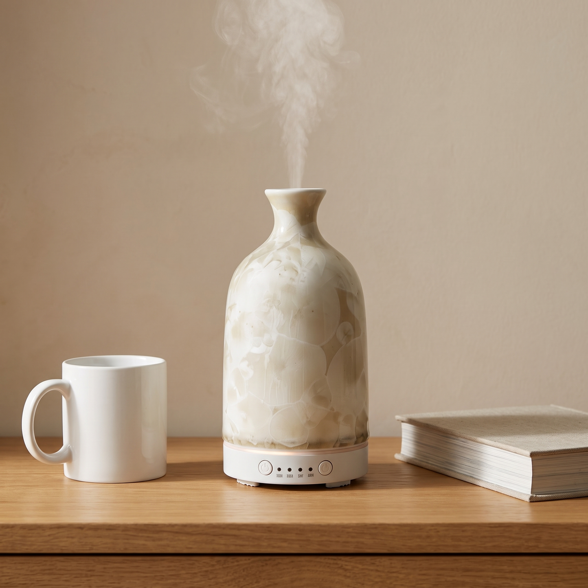 Aura Ceramic Stone Diffuser – size shown beside a standard mug and hardcover book