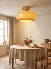 Charo Wood Cap Glass Ceiling Light - warm lifestyle in neutral dining room, amber glow, single fixture