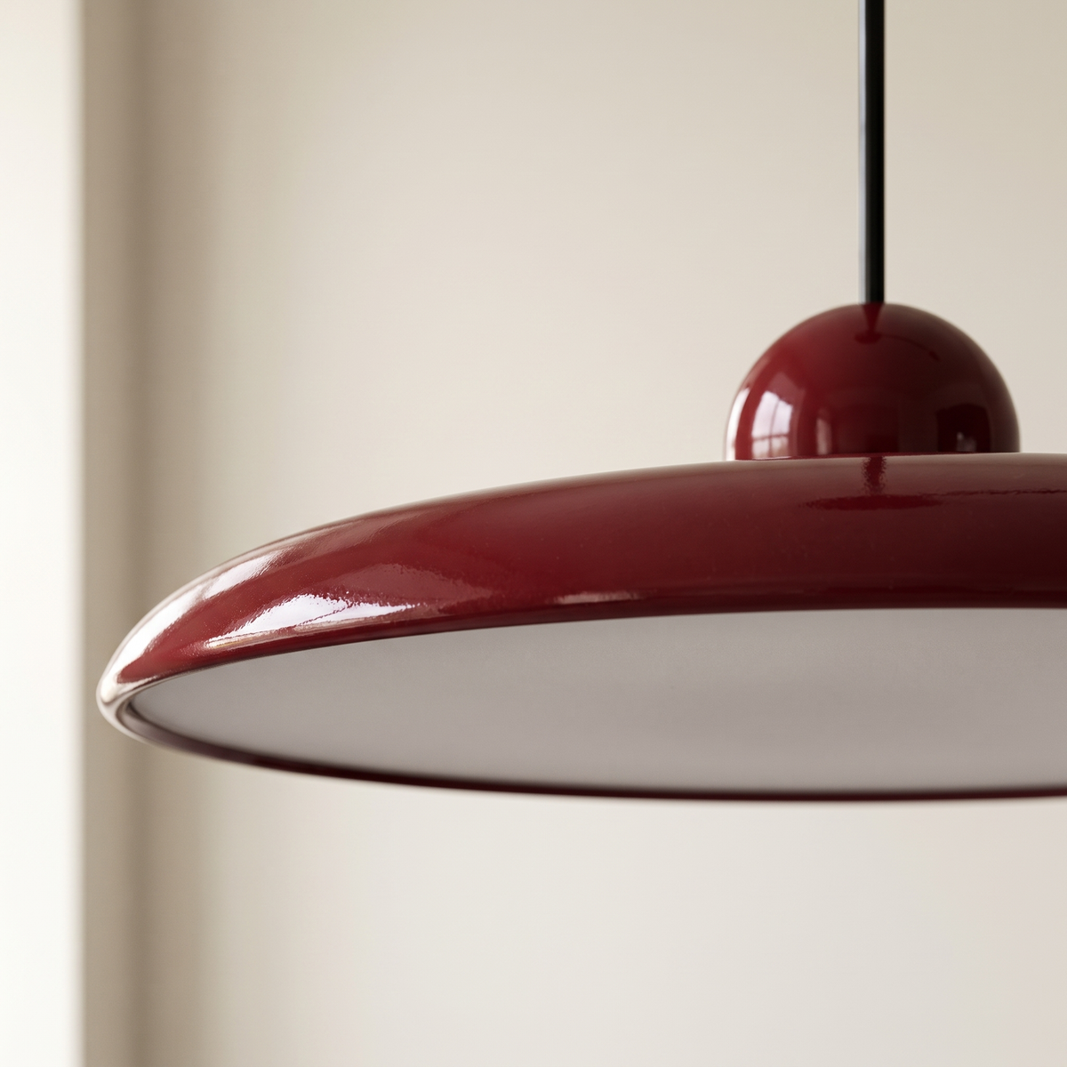 Fluxa Morandi Arm Pendant Light - red disc edge macro with polished sphere and gloss lacquer detail