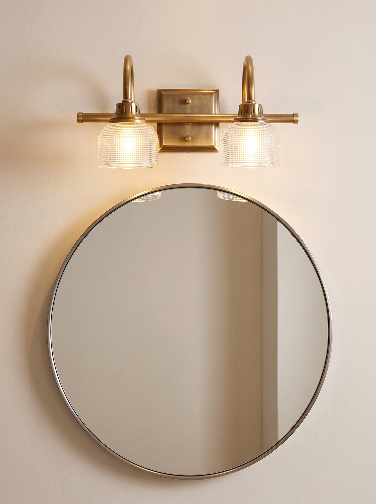 Prisa Prismatic Vanity Wall Light - scale reference above standard round bathroom mirror on cream wall