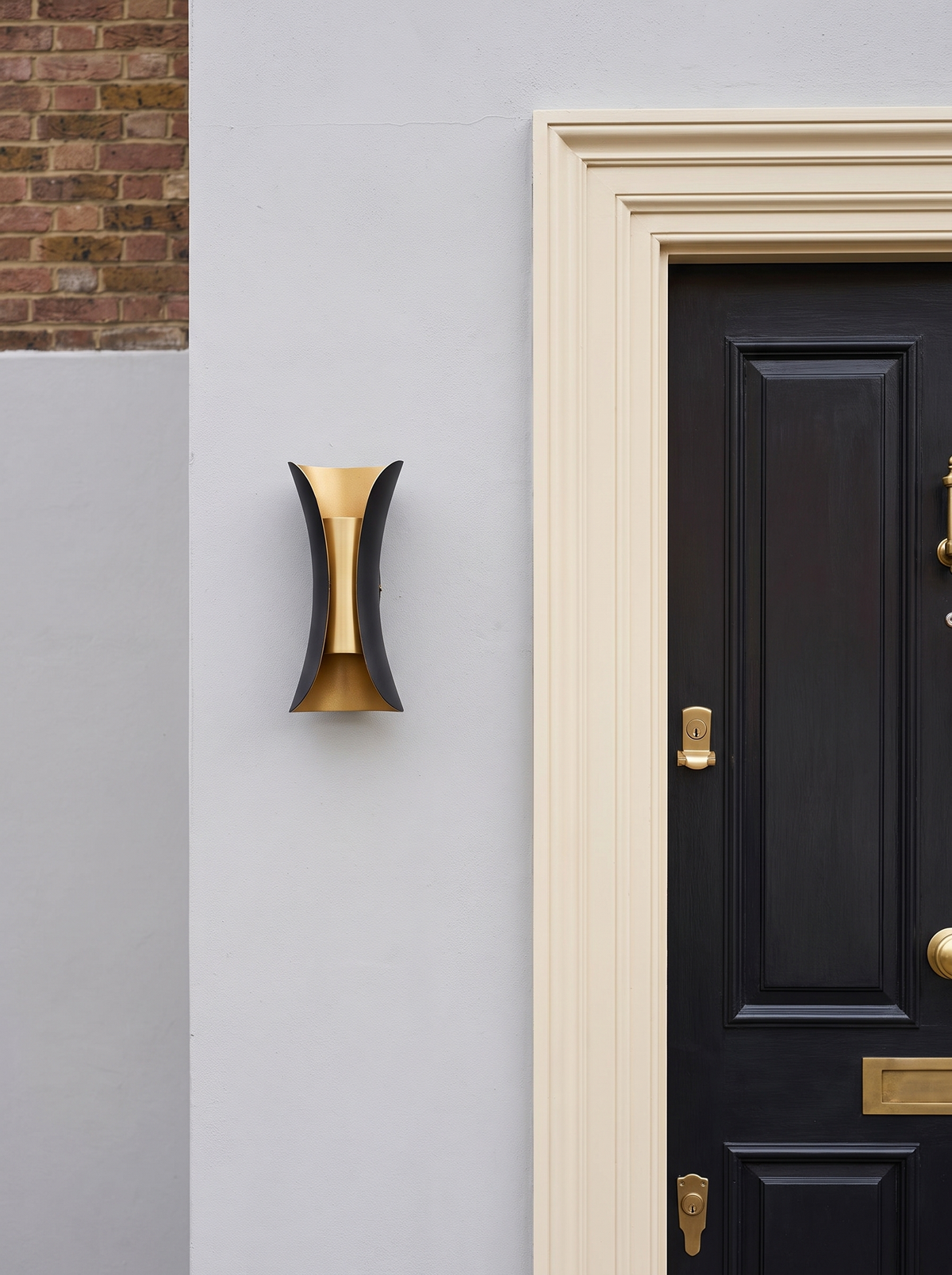Corva Curved Outdoor Wall Light - scale reference beside classic British front door showing compact 15cm fixture