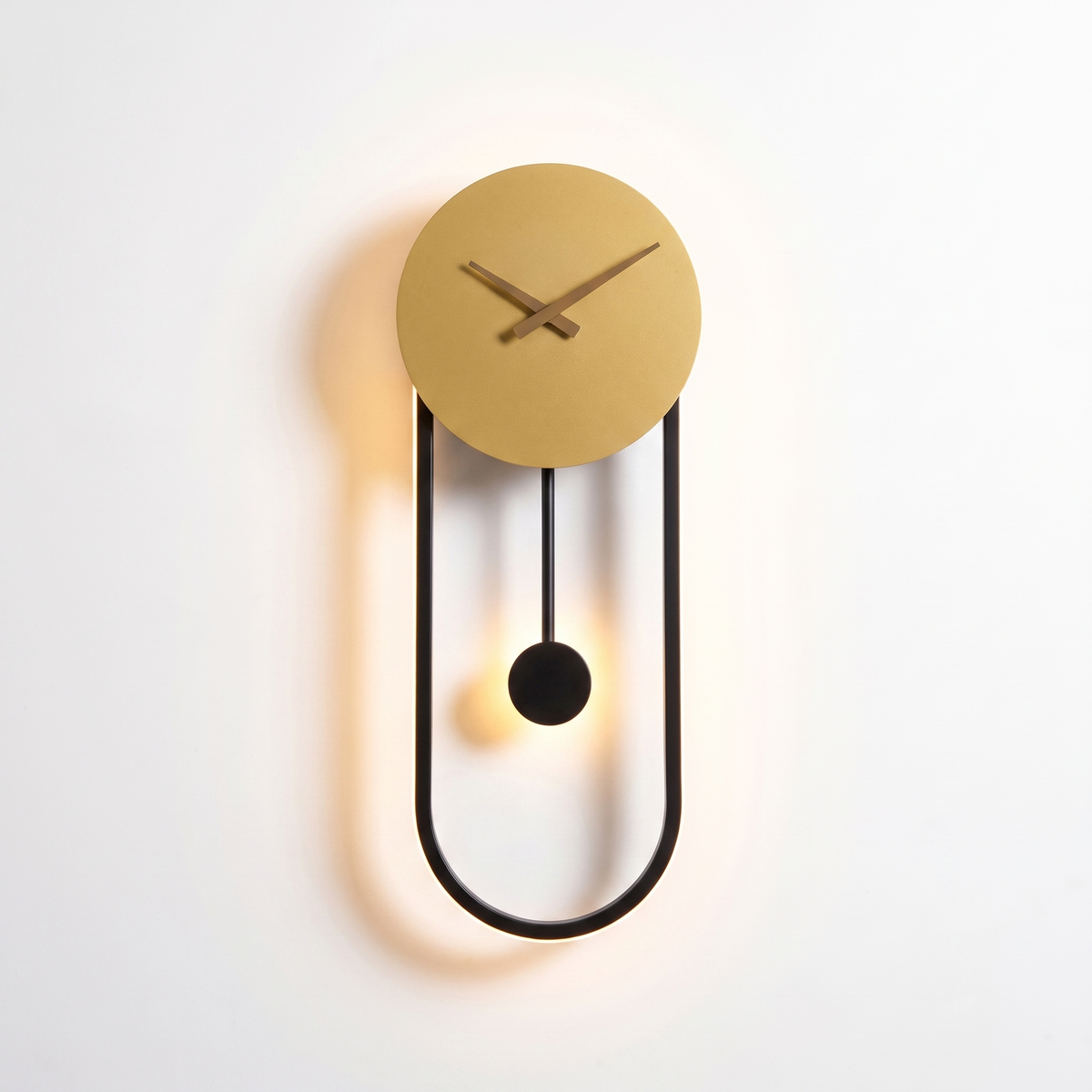 Kalve Clock Wall Light - gold disc and black oval frame product shot on white background