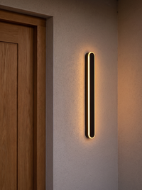 Orvo Linear Oval Outdoor Wall Light - scale reference beside timber door frame showing compact 40 cm size