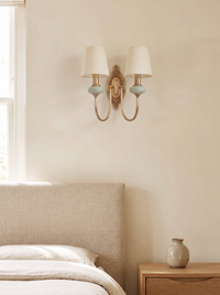 Orla Twin Fabric Shade Wall Light - scale context mounted above linen bed headboard in quiet luxury bedroom