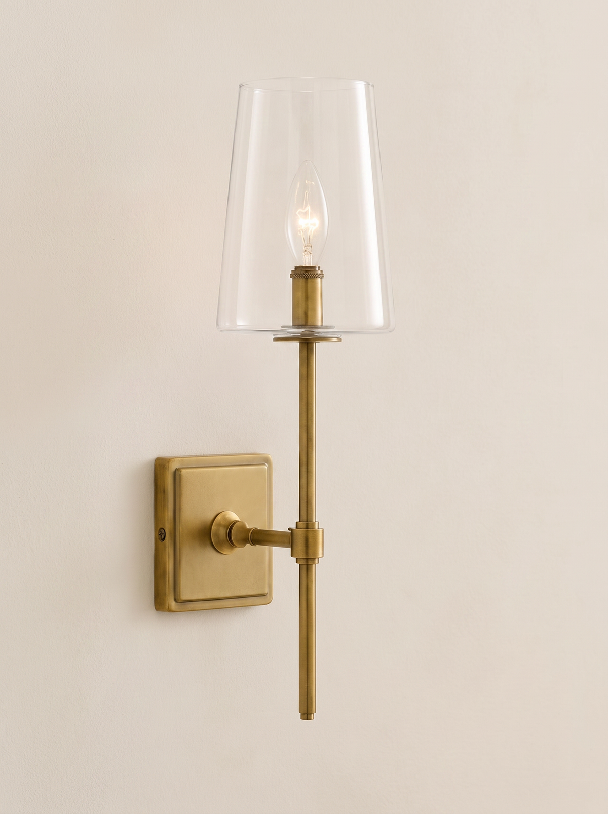 Torin Clear Glass Wall Sconce - clean centered hero on plain cream wall