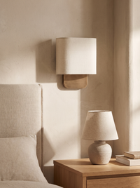 Lino Curved Linen Wall Light - scale lifestyle beside oak bed headboard and bedside table