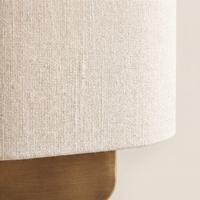 Lino Curved Linen Wall Light - macro close-up of natural linen weave and brushed brass backplate