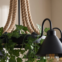 Corven Six-Arm Ceiling Light - macro close-up of twisted hemp rope cords and ivy leaves detail beside matte-black cone shade