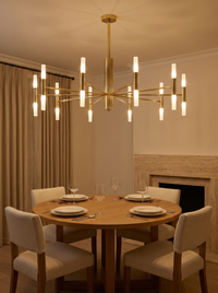 Cylma Cylinder Cluster Ceiling Light - warm dining room lifestyle with chandelier glowing above oak table and linen chairs
