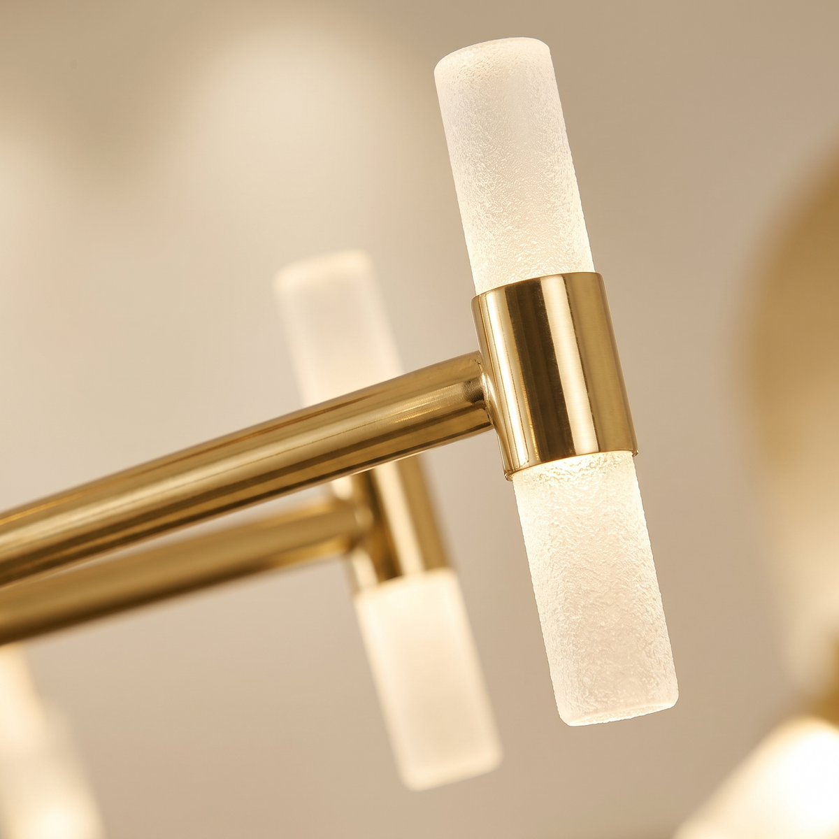 Cylma Cylinder Cluster Ceiling Light - macro close-up of frosted cylinder tubes and polished brass T-bar finish