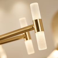 Cylma Cylinder Cluster Ceiling Light - macro close-up of frosted cylinder tubes and polished brass T-bar finish