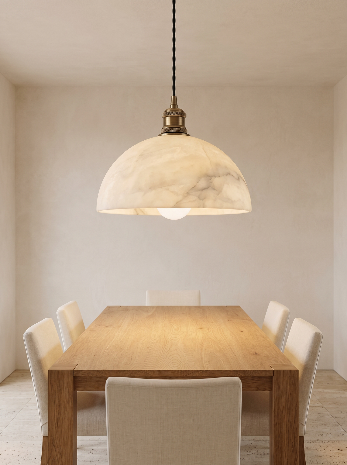 Delo Alabaster Dome Pendant Light - scale shot hanging above oak dining table with cream chairs