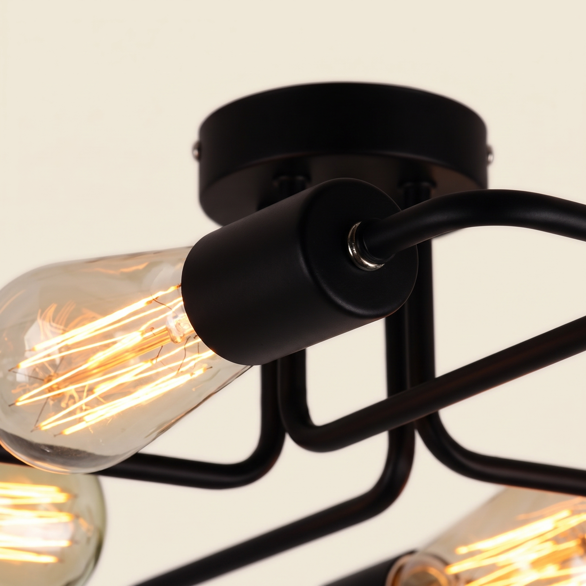 Indro Industrial Multi-Arm Ceiling Light - macro detail of matte black arm joint and Edison filament bulb