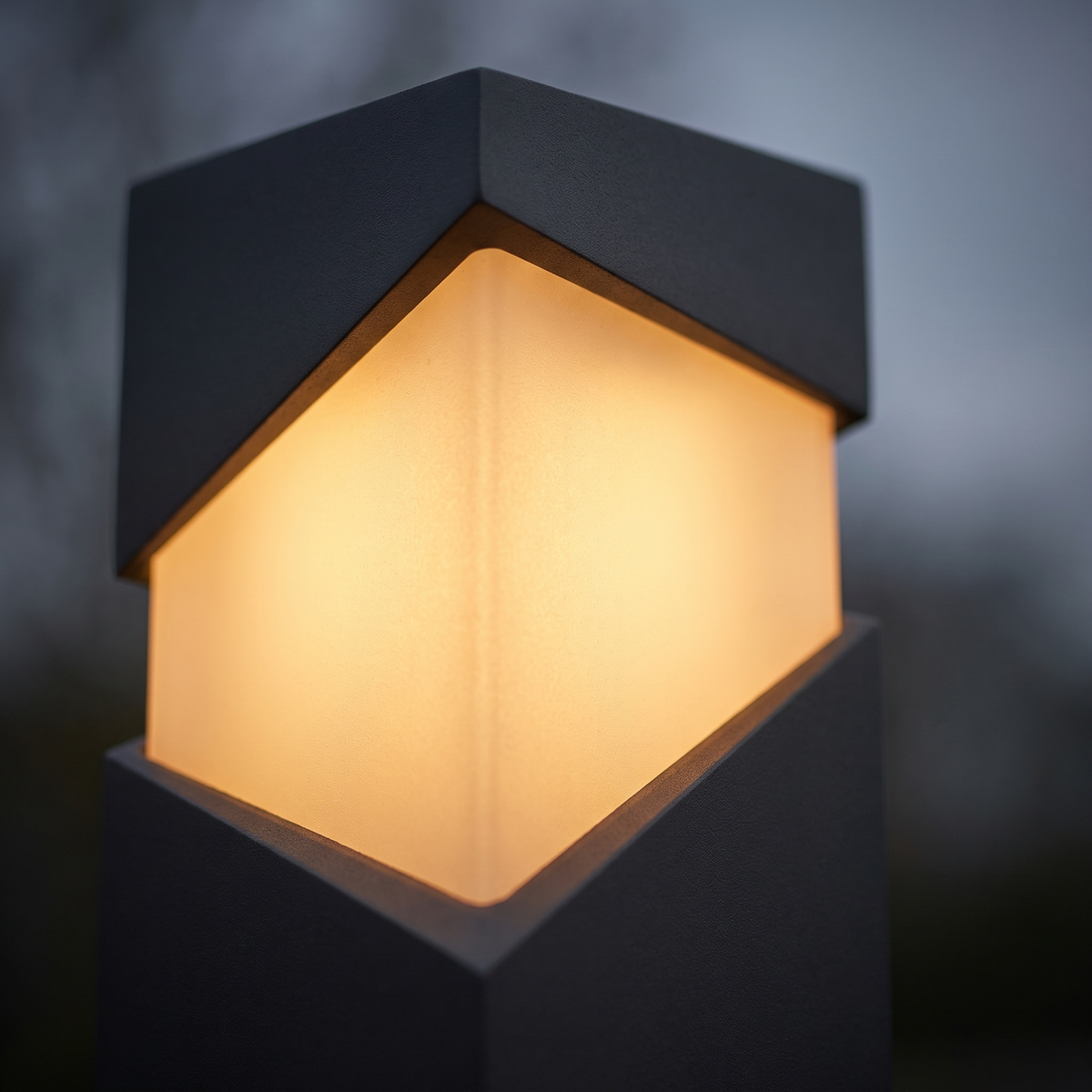 Kiro Pillar Post Light - macro close-up of warm glowing opal diffuser and matte graphite aluminium bevelled frame